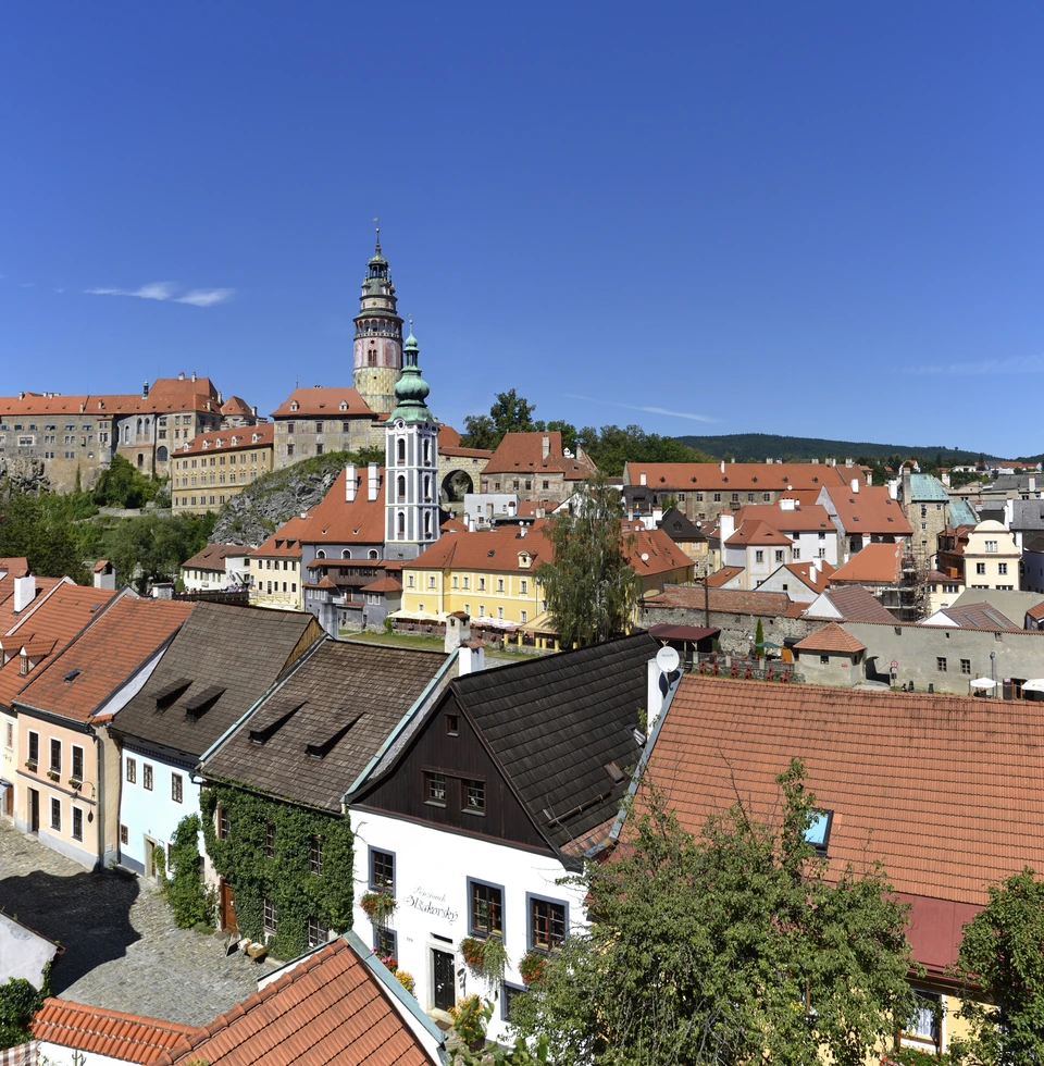 Český Krumlov castle tower and historic rooftops from Seminární zahrada